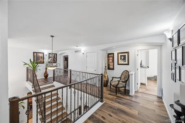 a bathroom with a sink vanity mirror and toilet