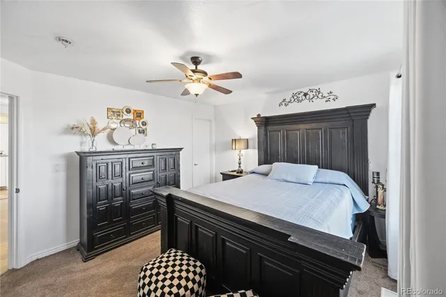 a bathroom with a sink vanity mirror and toilet