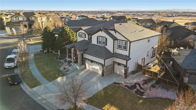an aerial view of a house with a swimming pool