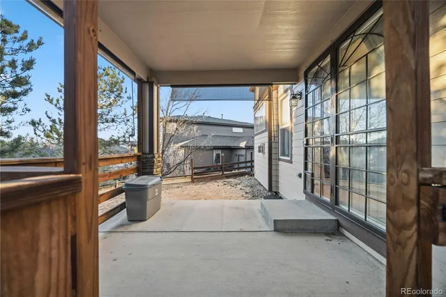 a view of a balcony with chairs