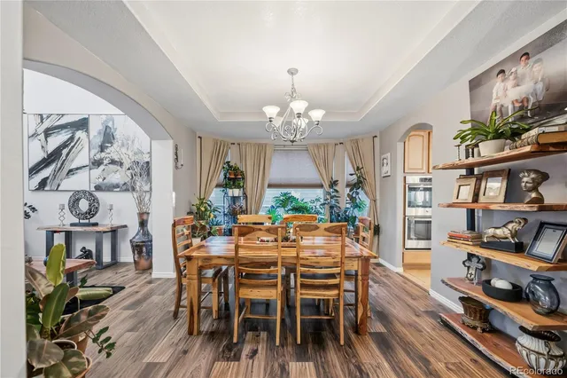 a large kitchen with stainless steel appliances granite countertop a sink stove and cabinets