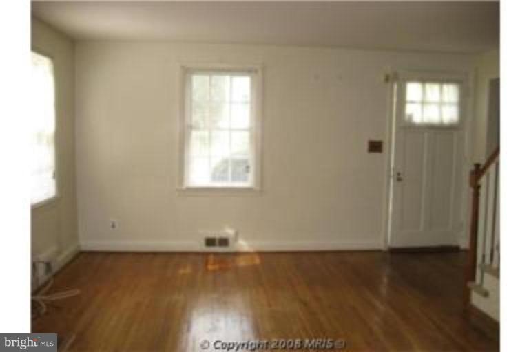 4213 Colonial Road Pikesville, MD 21208 - Photo 21 of 24 Gleaming hardwood floors just refinished in LR.