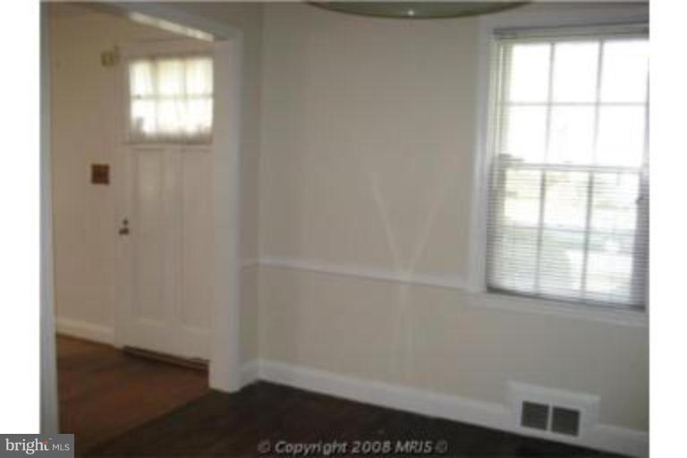 4213 Colonial Road Pikesville, MD 21208 - Photo 7 of 24 View from dining room to front door.