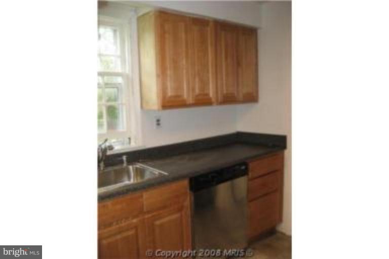 4213 Colonial Road Pikesville, MD 21208 - Photo 9 of 24 Sunny kitchen overlooking fenced back yard.