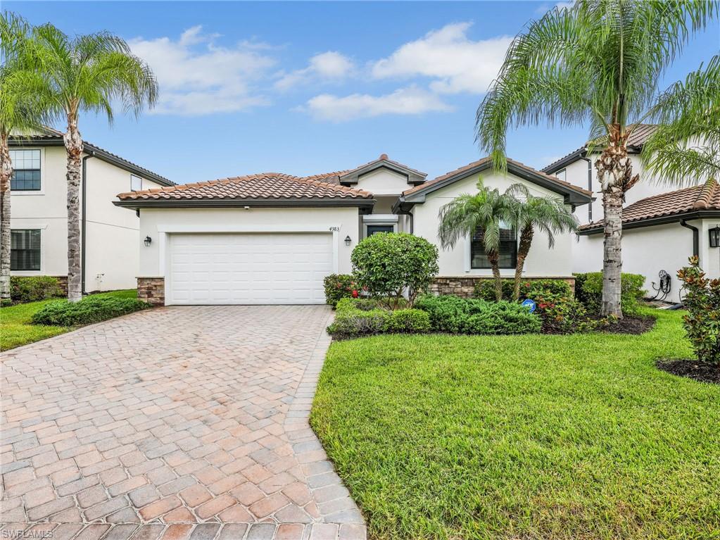 4383 Bismark Way Naples, FL 34119 - Photo 1 of 49 Front View with Landscaping & Paver Driveway