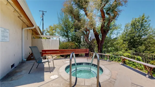 a view of a house with swimming pool and sitting area