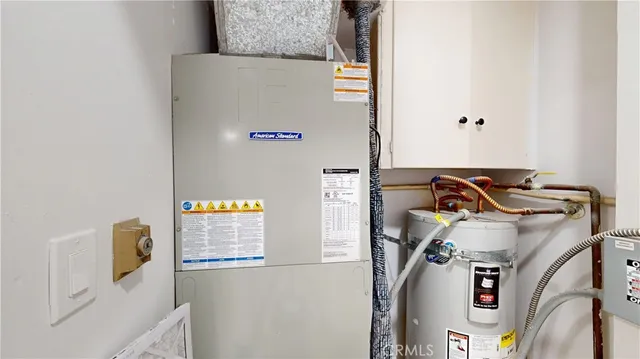 a kitchen with stainless steel appliances kitchen island granite countertop a refrigerator and a stove top oven