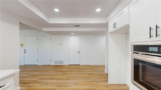 a living room with furniture fireplace and window