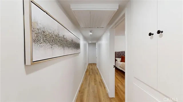 a bedroom with a bed window and a potted plant