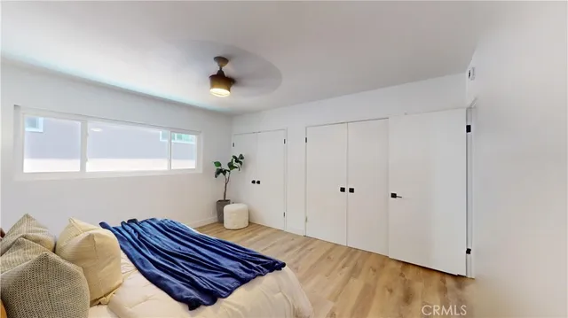 a bedroom with a bed and window