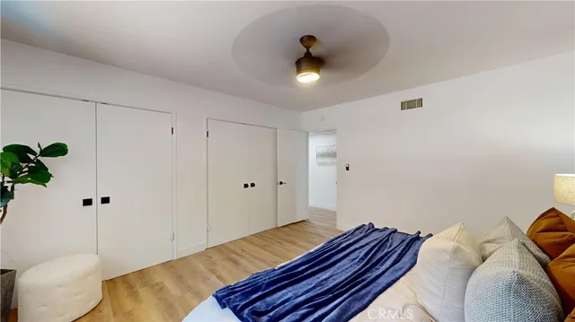 a living room with fireplace furniture and a wooden floor