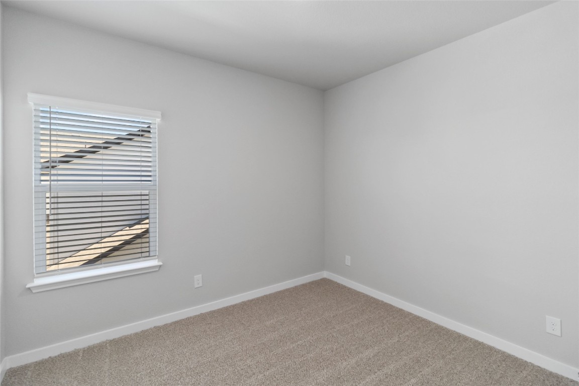 840 Staglin Street, Unit B Buda, TX 78610 - Photo 15 of 17 Carpeted empty room featuring baseboards