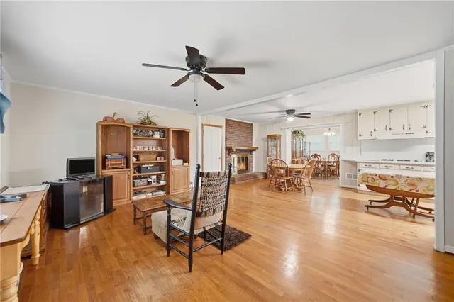 a view of a livingroom with furniture and a flat screen tv