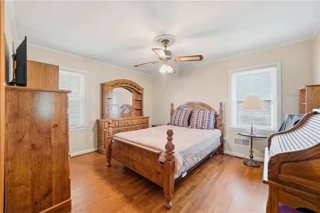 a bed room with a bed and a chandelier