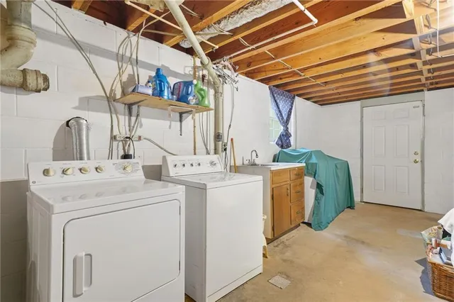 a utility room with dryer and washer