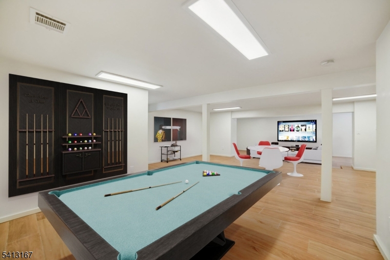 156 Park Road Parsippany, NJ 07054 - Photo 39 of 44 a living room with furniture pool table and wall paintings