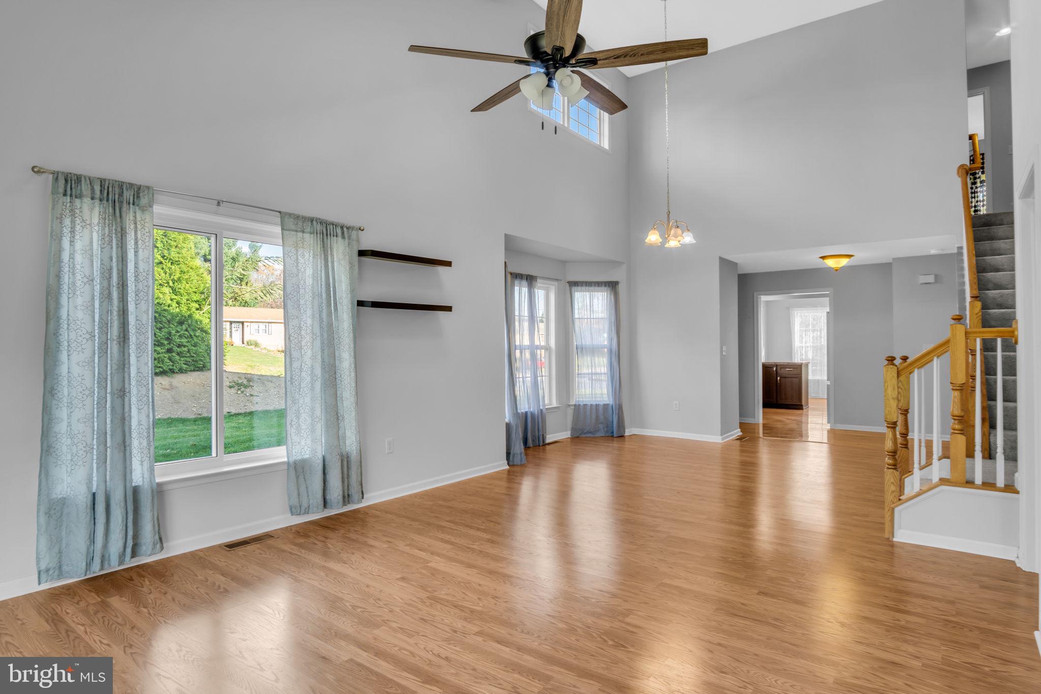 2 Round Ridge Road Mechanicsburg, PA 17055 - Photo 12 of 35 a view of an empty room with wooden floor and a window