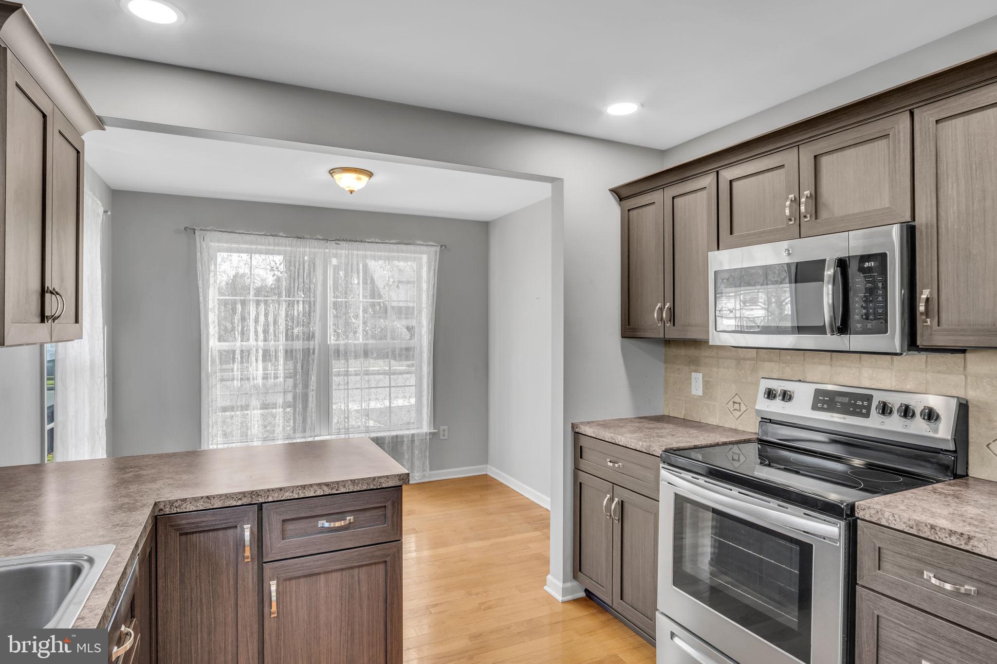 2 Round Ridge Road Mechanicsburg, PA 17055 - Photo 16 of 35 a kitchen with a stove and a microwave