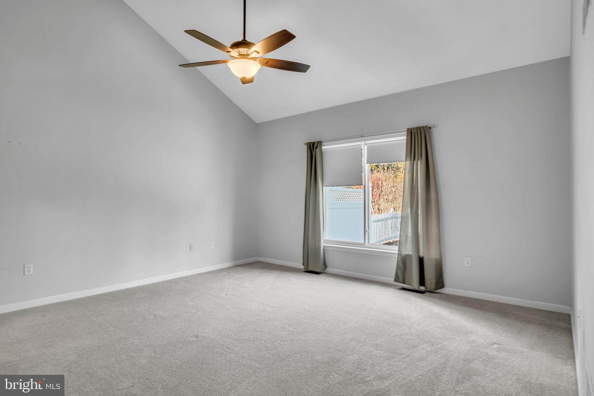 2 Round Ridge Road Mechanicsburg, PA 17055 - Photo 19 of 35 an empty room with a window and a ceiling fan