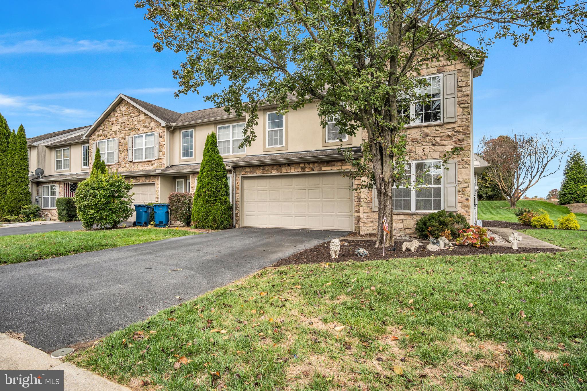 2 Round Ridge Road Mechanicsburg, PA 17055 - Photo 2 of 35 a front view of a house with a yard and garage