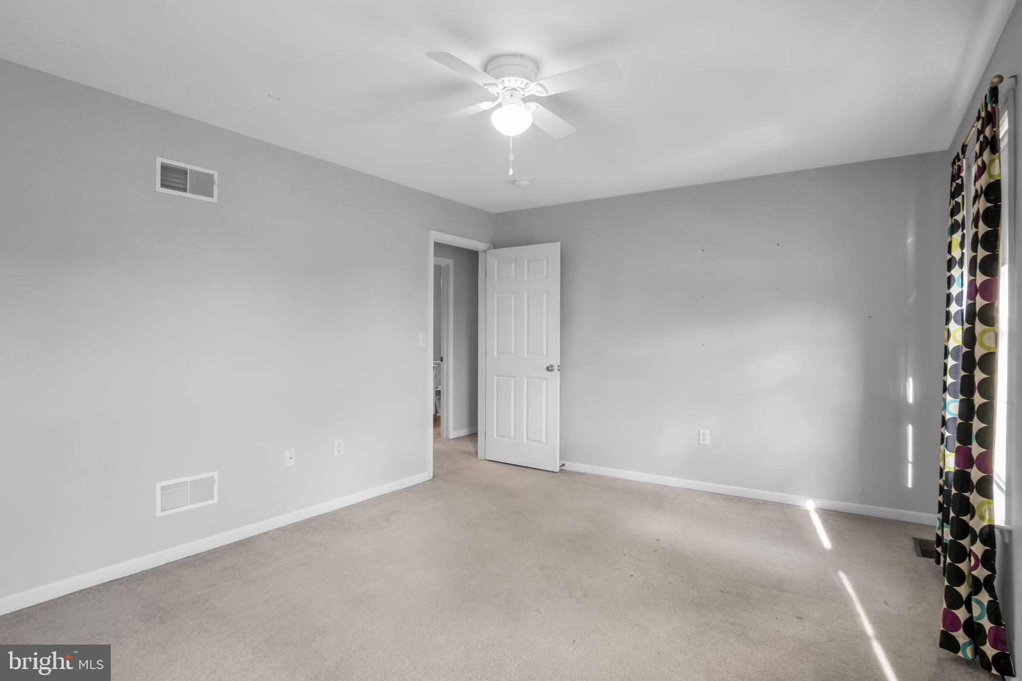 2 Round Ridge Road Mechanicsburg, PA 17055 - Photo 30 of 35 a view of an empty room with a window and a ceiling fan