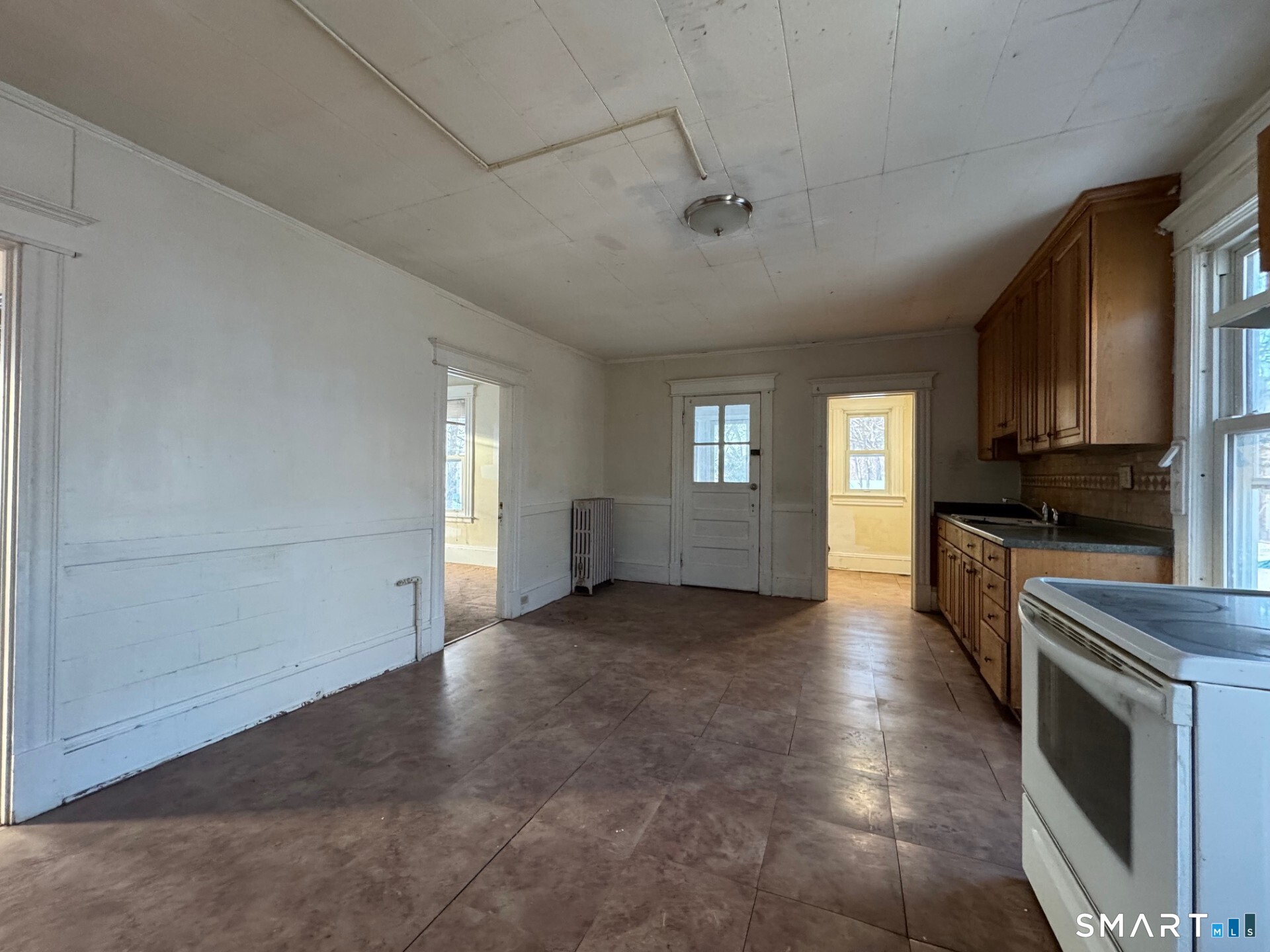231 School Street Manchester, CT 06040 - Photo 11 of 37 a view of a windows and an empty room with a kitchen