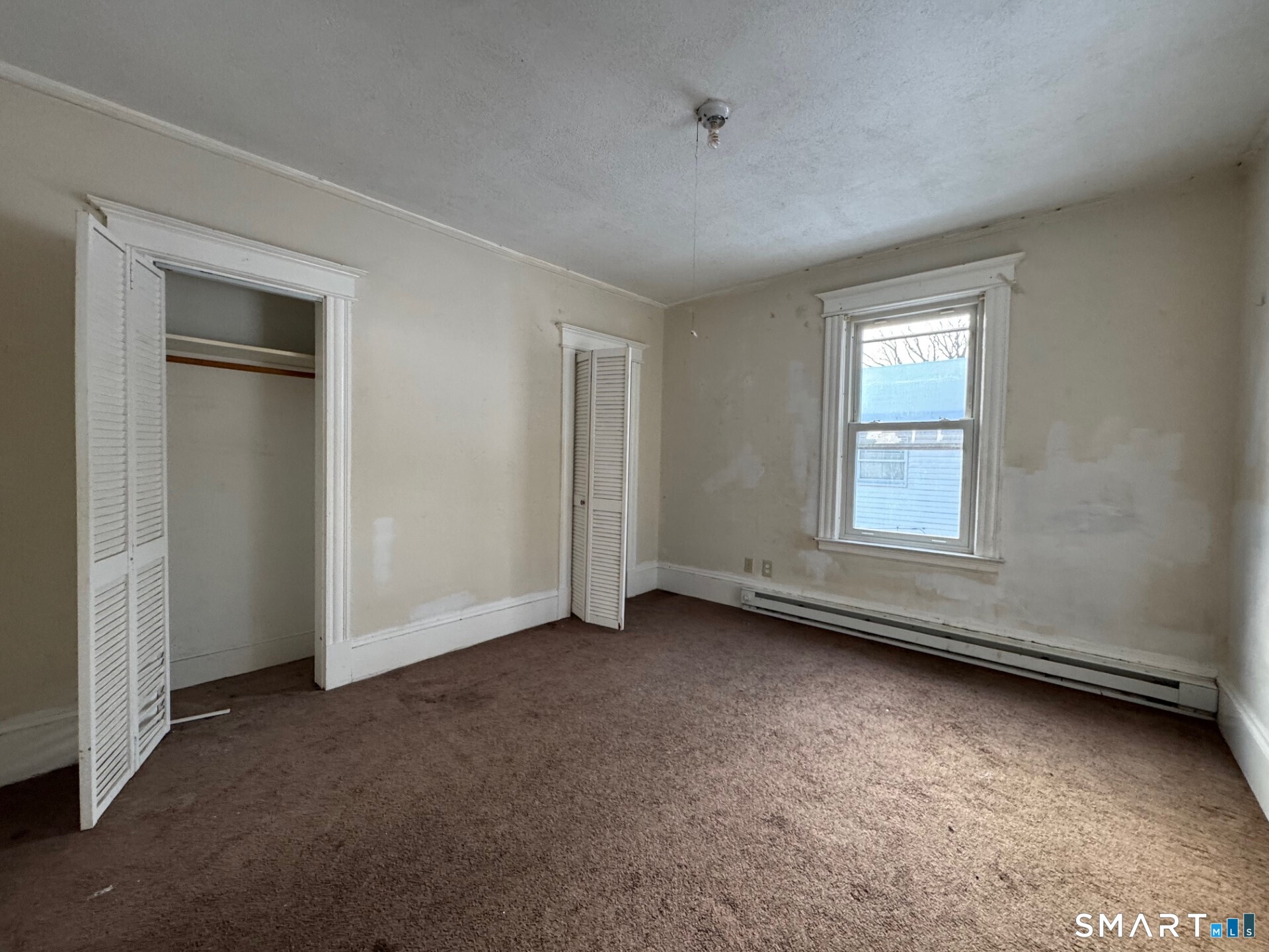 231 School Street Manchester, CT 06040 - Photo 17 of 37 an empty room with windows