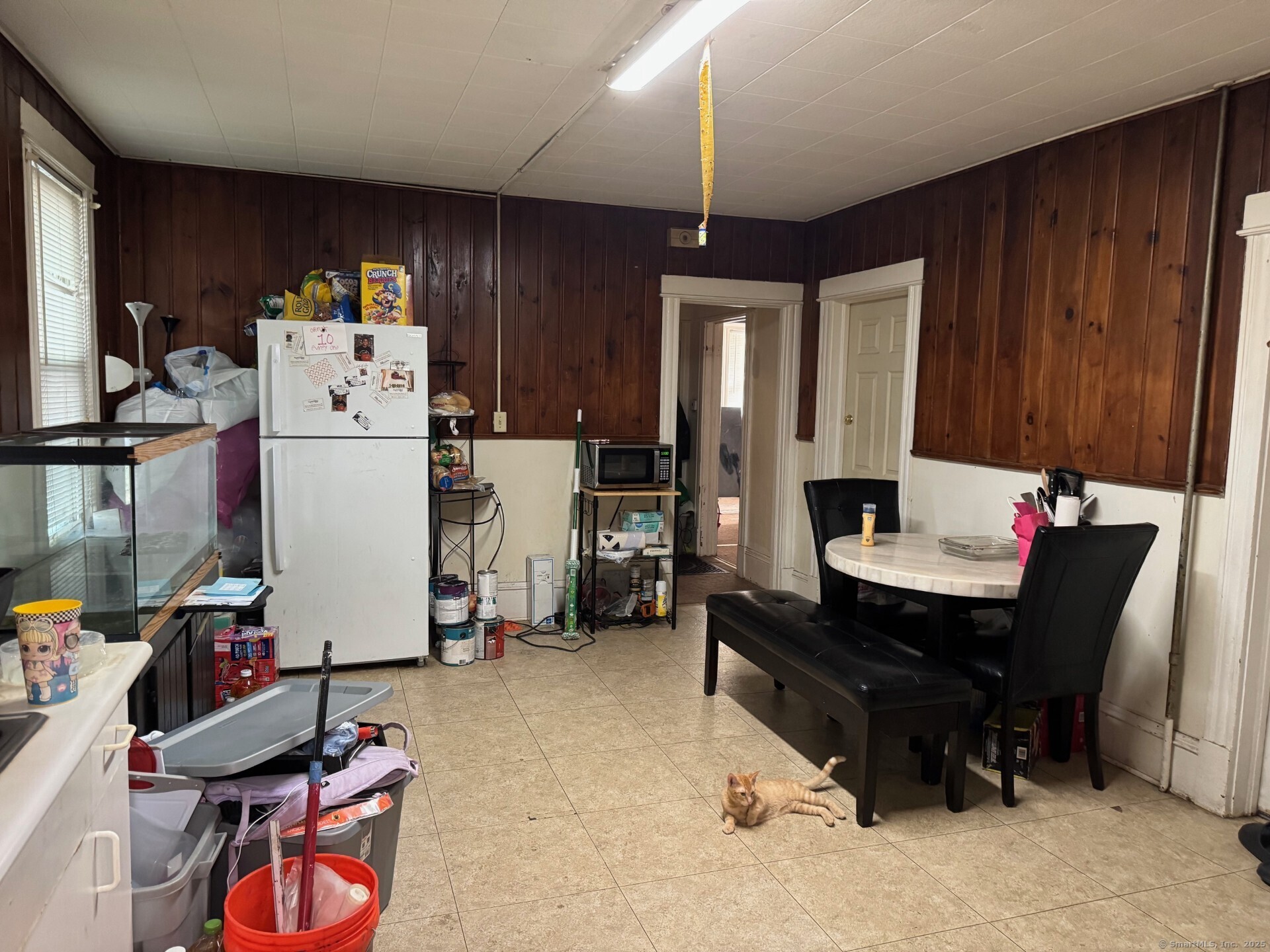 231 School Street Manchester, CT 06040 - Photo 23 of 37 a room with furniture a rug and a chandelier