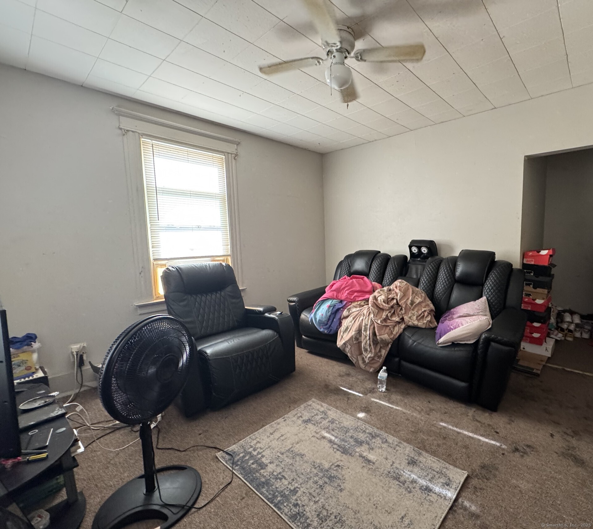 231 School Street Manchester, CT 06040 - Photo 24 of 37 a living room with furniture a rug and a window