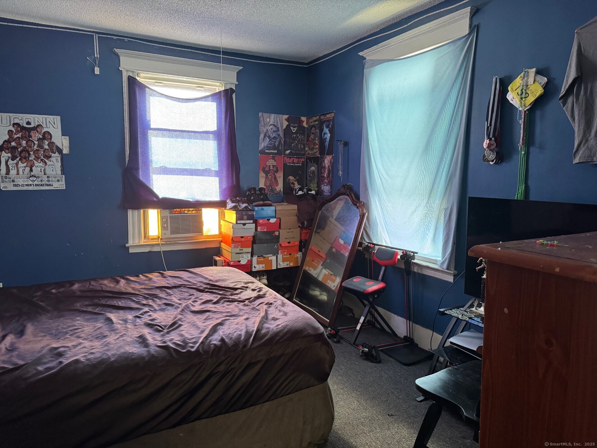 231 School Street Manchester, CT 06040 - Photo 26 of 37 a bedroom with a bed and a window