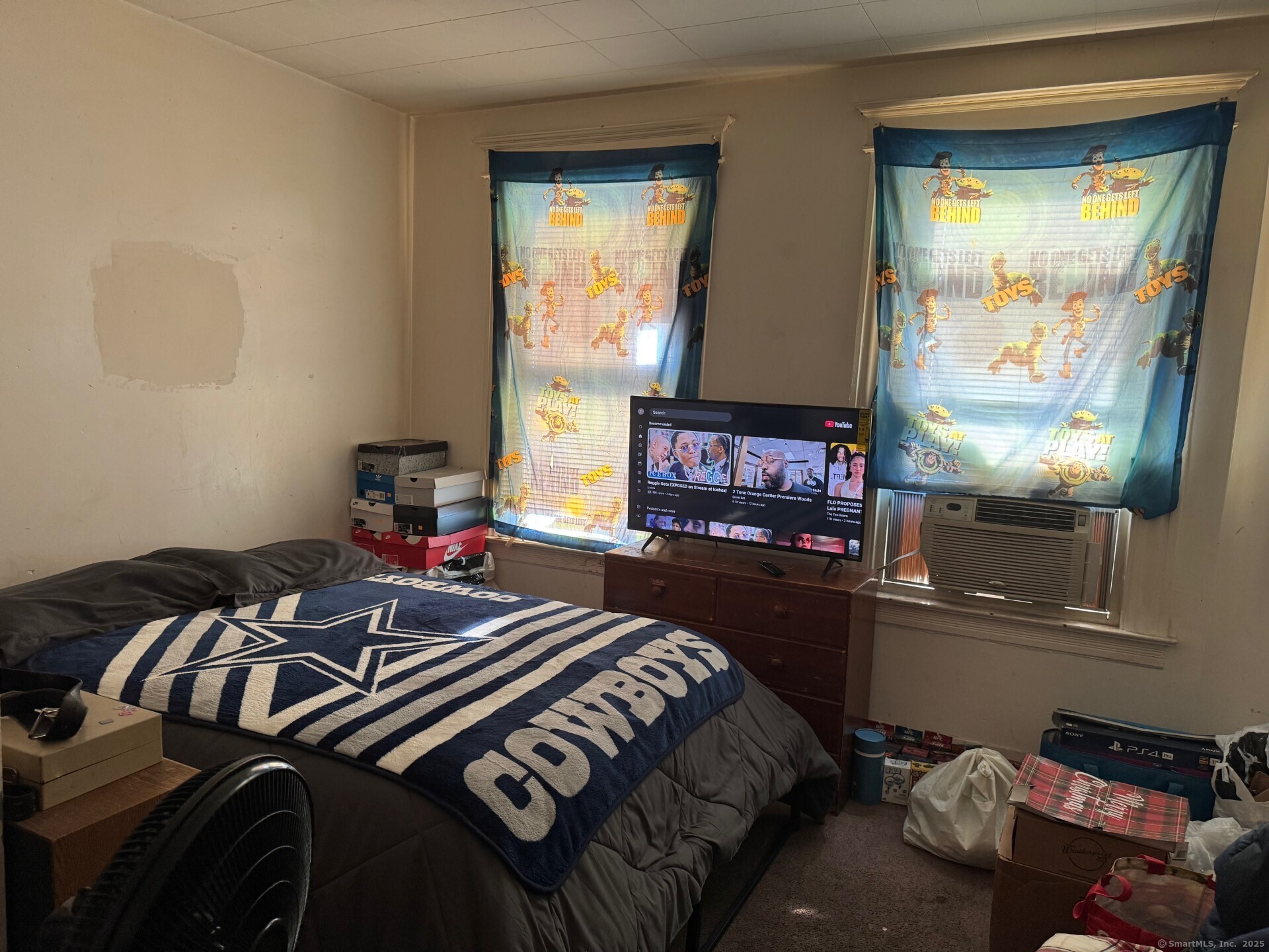 231 School Street Manchester, CT 06040 - Photo 27 of 37 a bedroom with a bed and a window