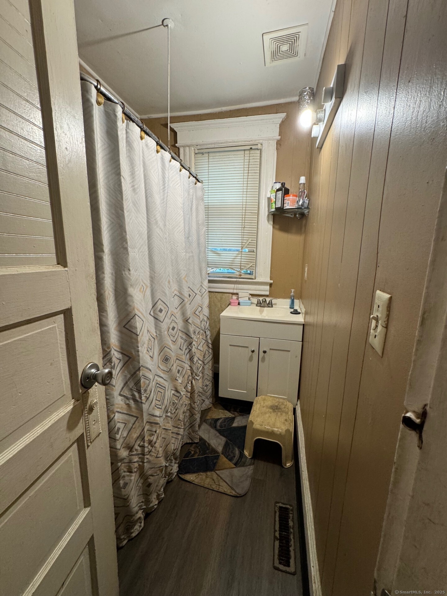231 School Street Manchester, CT 06040 - Photo 29 of 37 a bathroom with sink mirror and toilet
