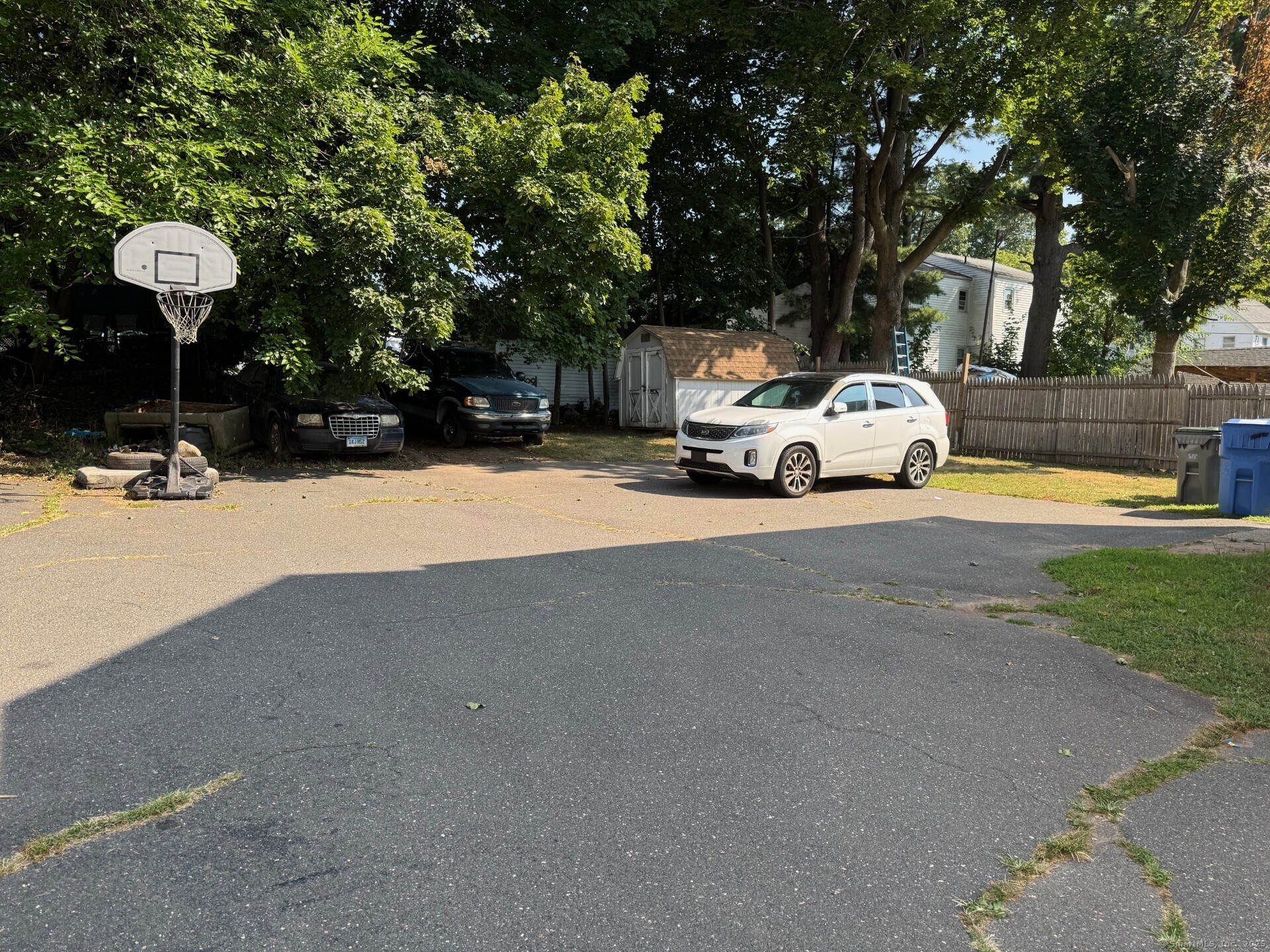 231 School Street Manchester, CT 06040 - Photo 5 of 37 a view of a house with a back yard