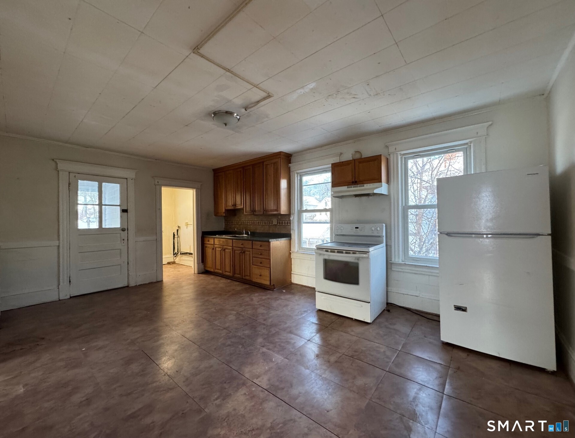 231 School Street Manchester, CT 06040 - Photo 9 of 37 a view of a kitchen with a sink an oven and refrigerator