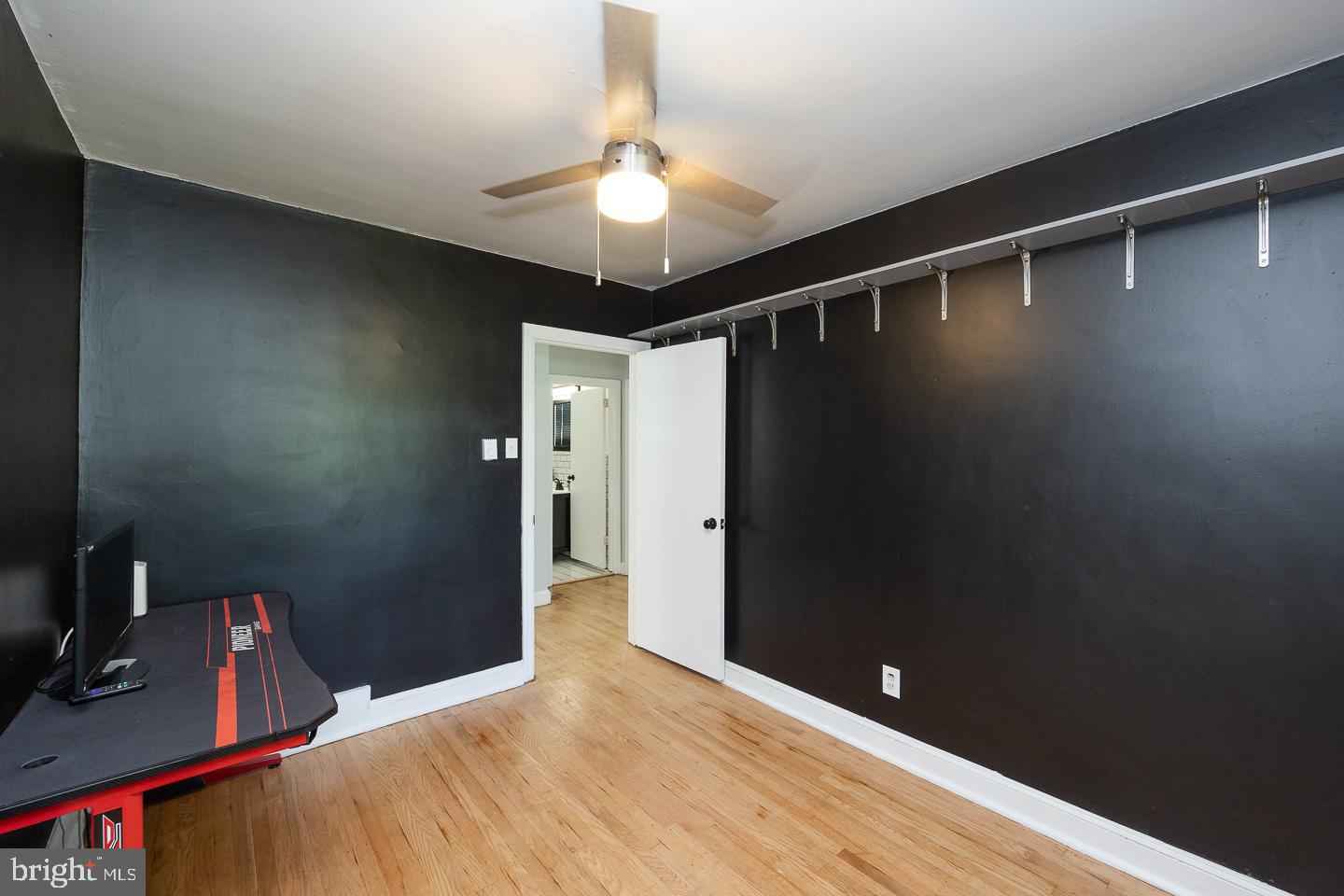 312 Lawrence Road Broomall, PA 19008 - Photo 19 of 23 a bedroom with a bed and a chandelier