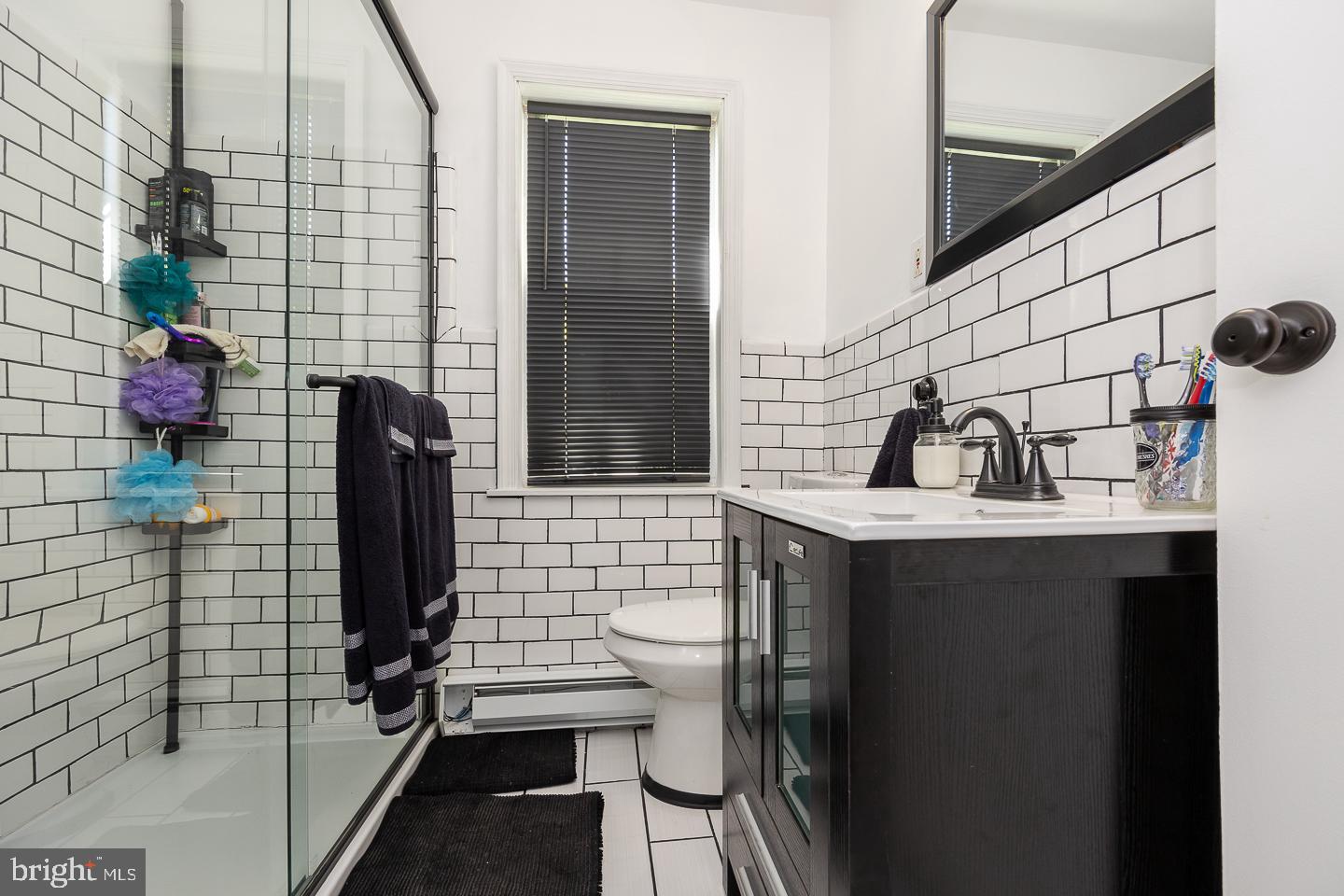 312 Lawrence Road Broomall, PA 19008 - Photo 20 of 23 a bathroom with a sink a toilet and shower
