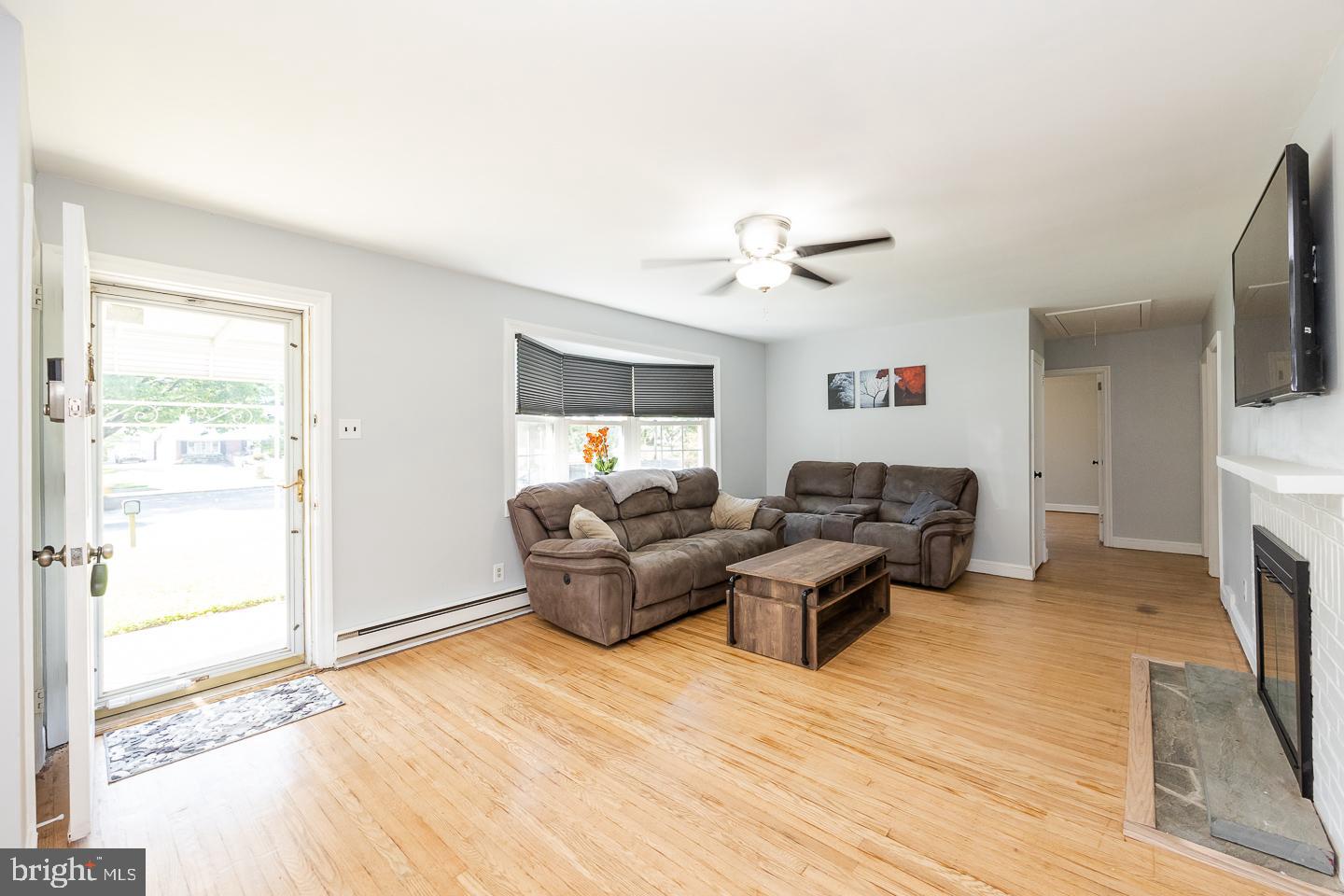 312 Lawrence Road Broomall, PA 19008 - Photo 3 of 23 a living room with furniture and a flat screen tv