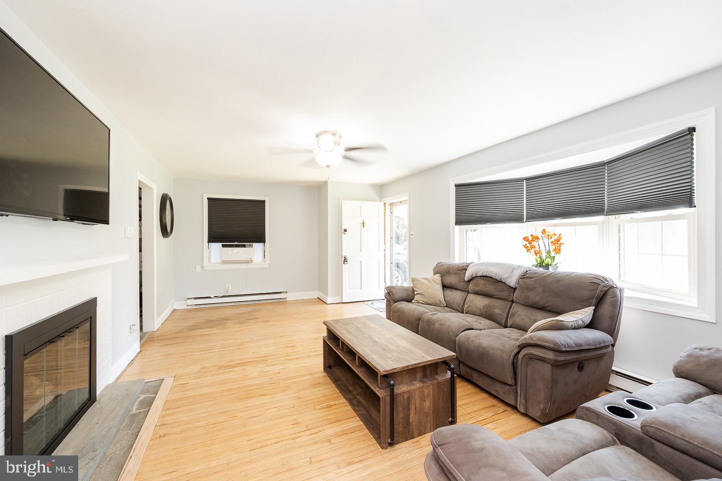 312 Lawrence Road Broomall, PA 19008 - Photo 4 of 23 a living room with furniture and a flat screen tv