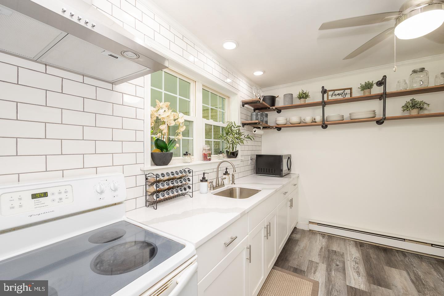 312 Lawrence Road Broomall, PA 19008 - Photo 6 of 23 a bathroom with a sink and a mirror