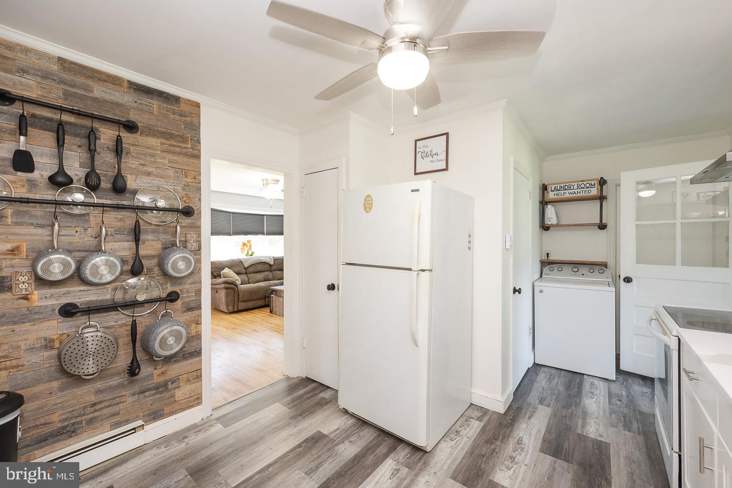312 Lawrence Road Broomall, PA 19008 - Photo 9 of 23 a view of a livingroom with wooden floor