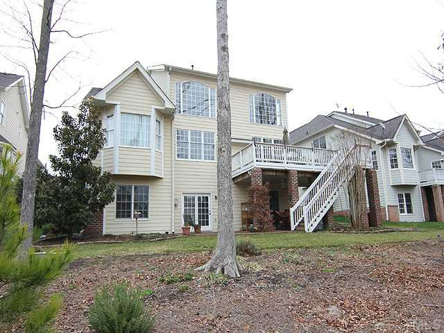 9137 Sanctuary Court Raleigh, NC 27617 - Photo 11 of 17 a front view of a house with a yard