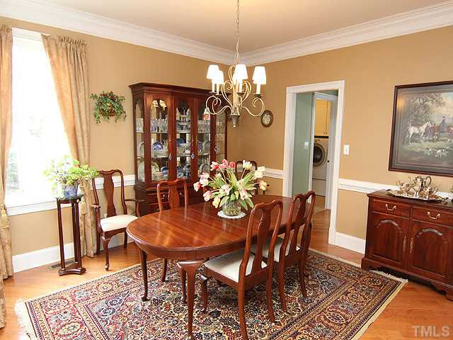 9137 Sanctuary Court Raleigh, NC 27617 - Photo 3 of 17 a view of a dining room with furniture