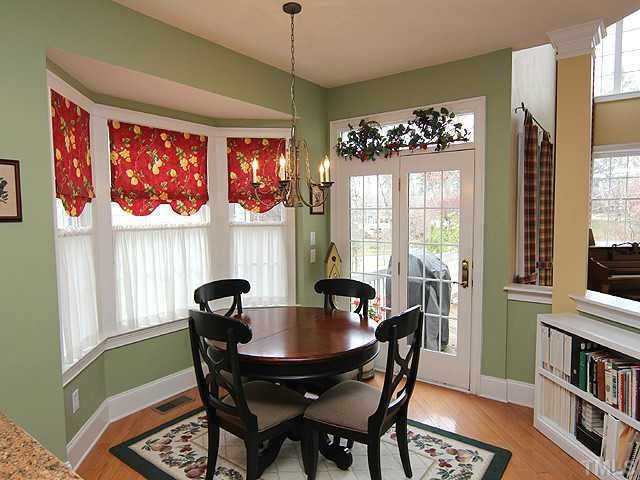 9137 Sanctuary Court Raleigh, NC 27617 - Photo 5 of 17 a view of a dining room with furniture window and outside view