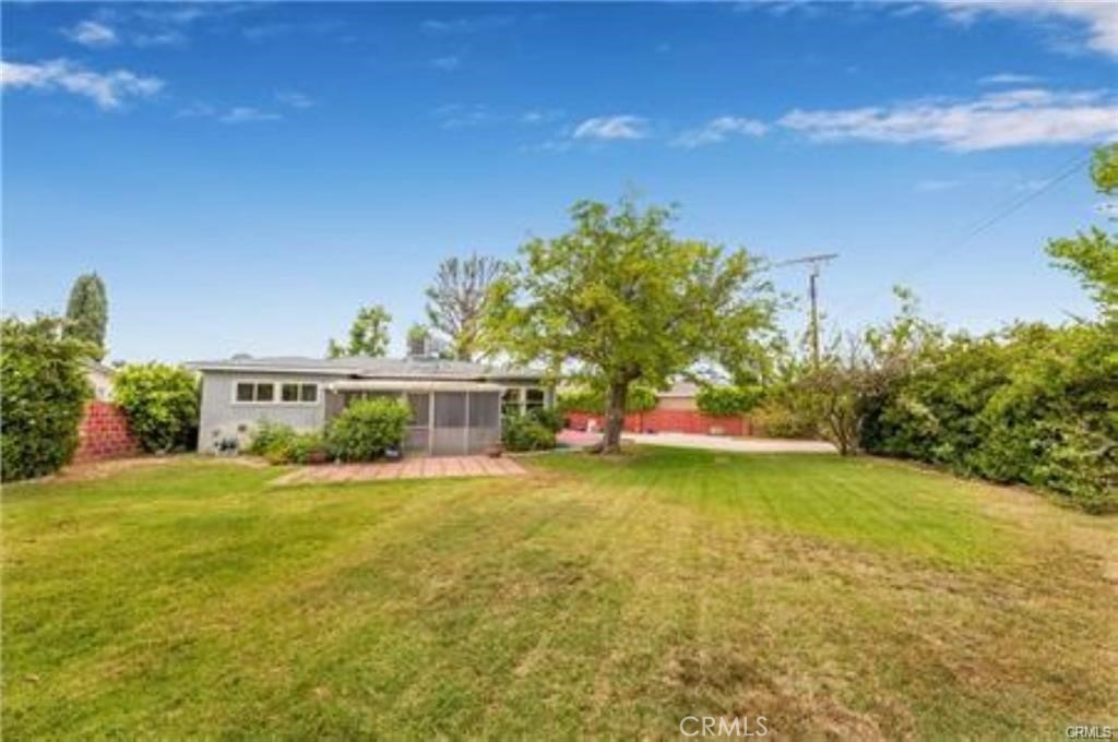 15853 Romar Street North Hills, CA 91343 - Photo 16 of 16 a view of a house with a yard and garage
