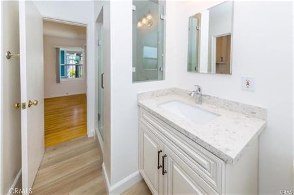 15853 Romar Street North Hills, CA 91343 - Photo 8 of 16 a bathroom with a sink and a mirror