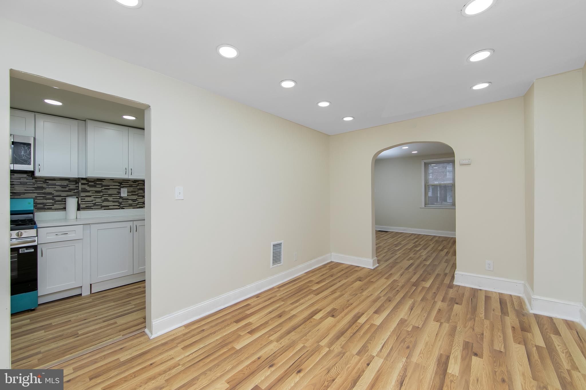 3156 Alabama Road Camden, NJ 08104 - Photo 11 of 31 a view of kitchen with granite countertop cabinets and wooden floor