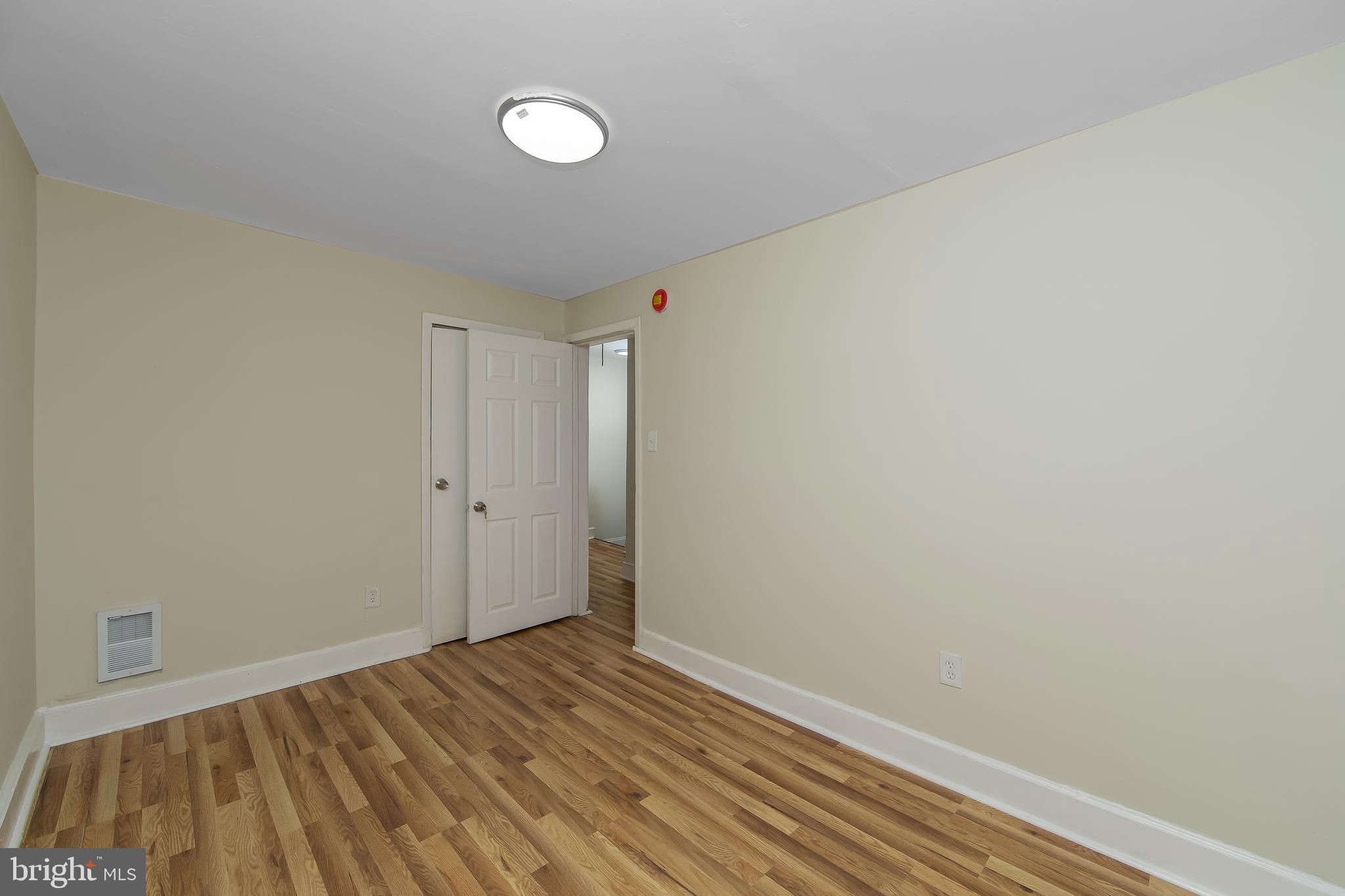 3156 Alabama Road Camden, NJ 08104 - Photo 23 of 31 a view of room with wooden floor