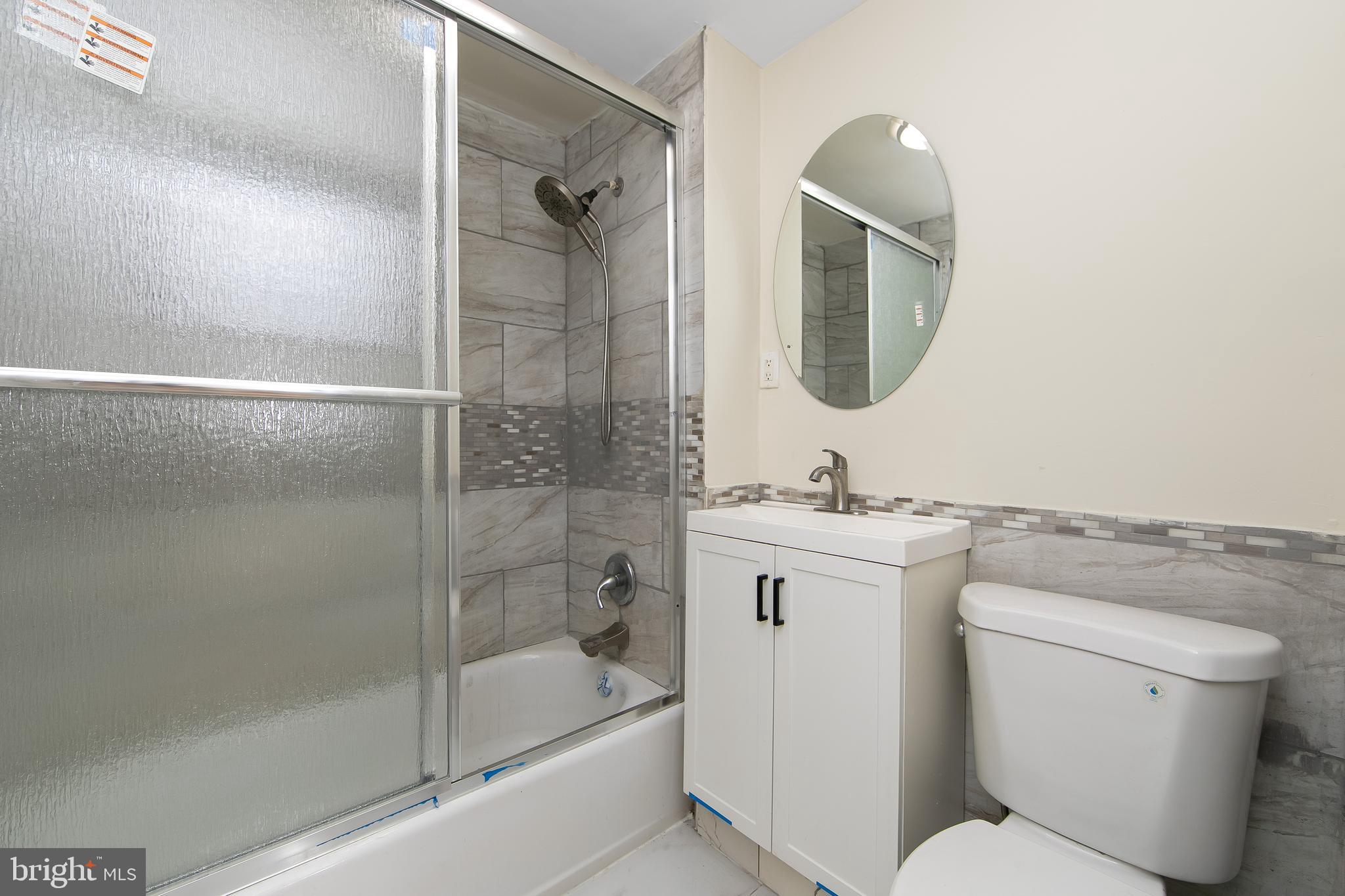 3156 Alabama Road Camden, NJ 08104 - Photo 27 of 31 a bathroom with a toilet sink and shower