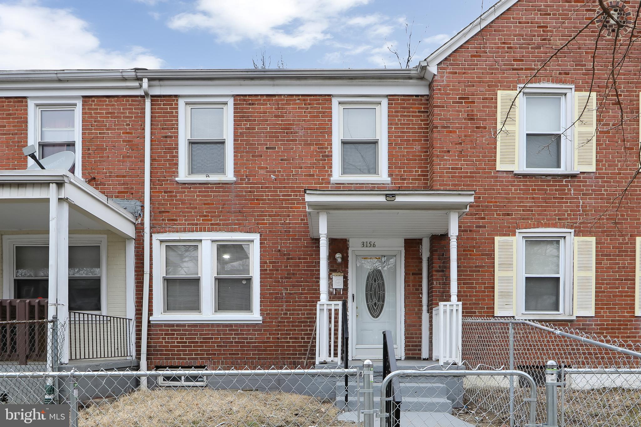 3156 Alabama Road Camden, NJ 08104 - Photo 5 of 31 front view of a brick house with many windows