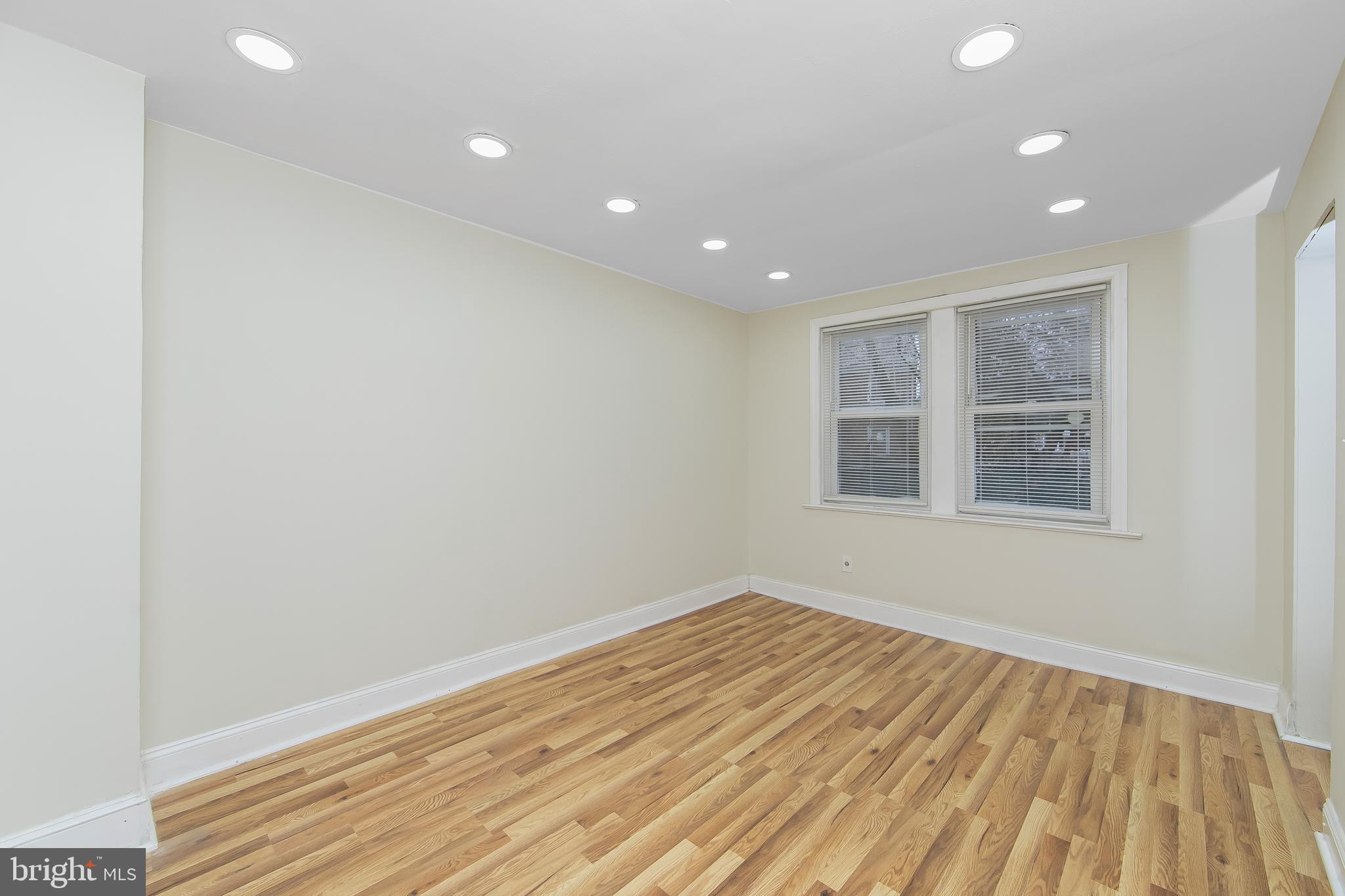 3156 Alabama Road Camden, NJ 08104 - Photo 10 of 31 a view of empty room with wooden floor and fan